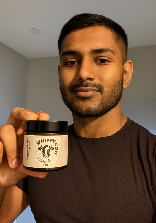 Person holding a jar labeled 'Whippy Cow Skincare'.