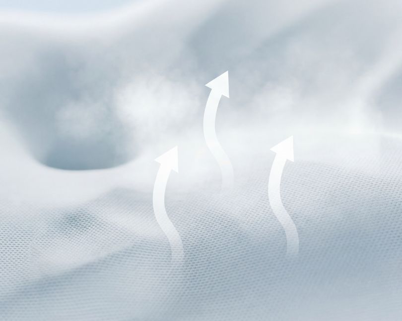 A close-up of a light blue fabric with steam and arrows rising from it to illustrate breathability.