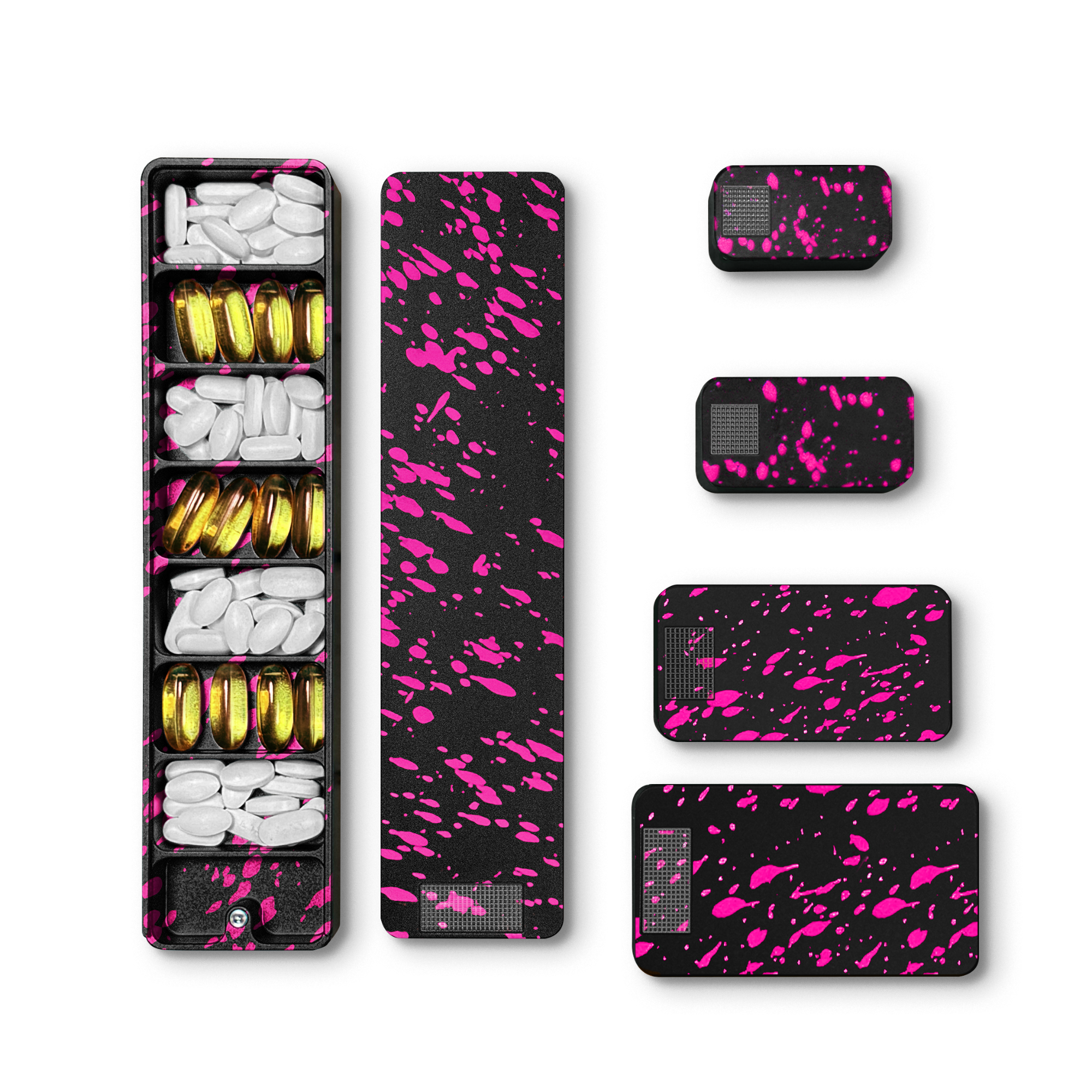 A set of black and pink splatter-patterned pill organizers, one open with white and gold pills.