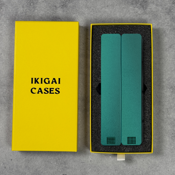 Yellow box with 'Ikigai Cases' next to blue cases in foam insert.