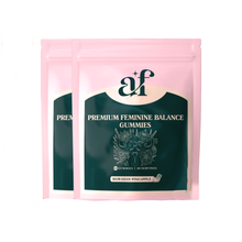 Two pink packages labeled 'Premium Feminine Balance Gummies' with floral design.
