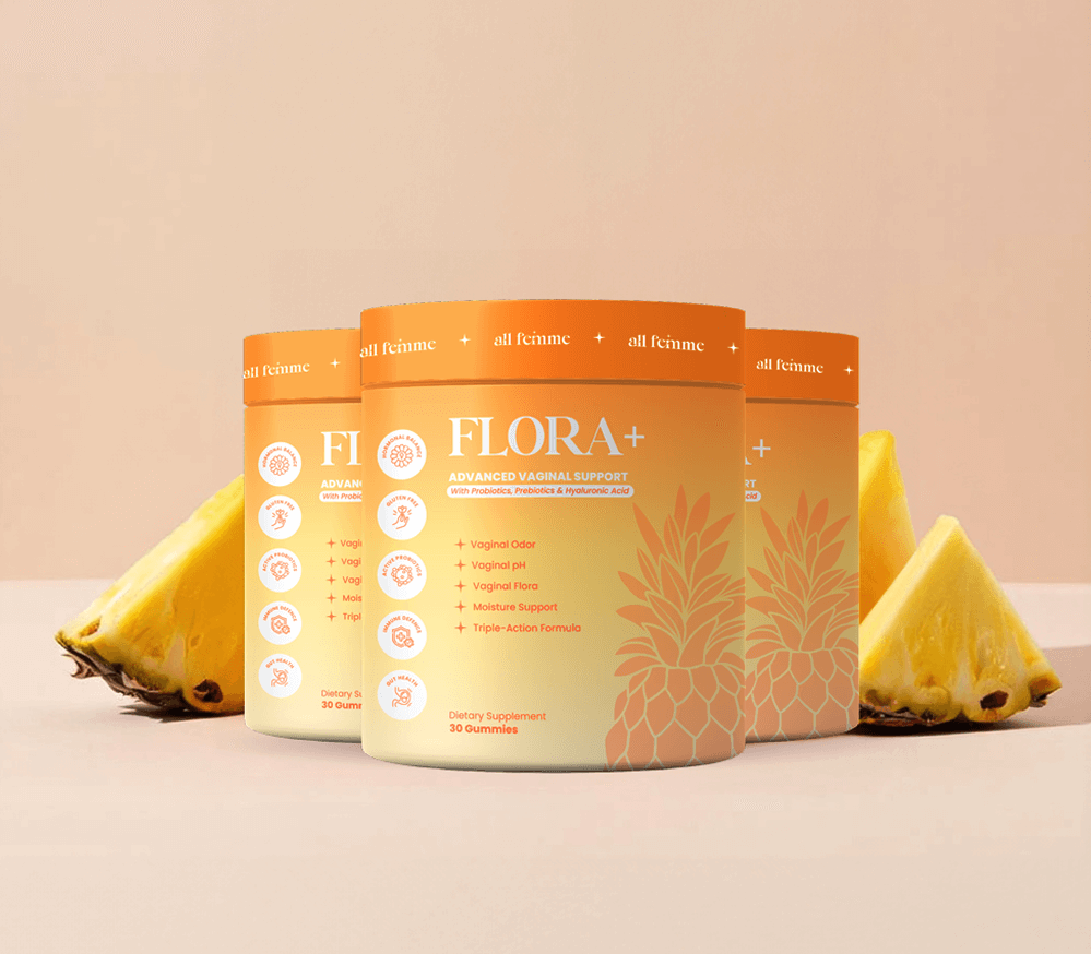 Three orange containers labeled 'FLORA+' with pineapple slices in the background.