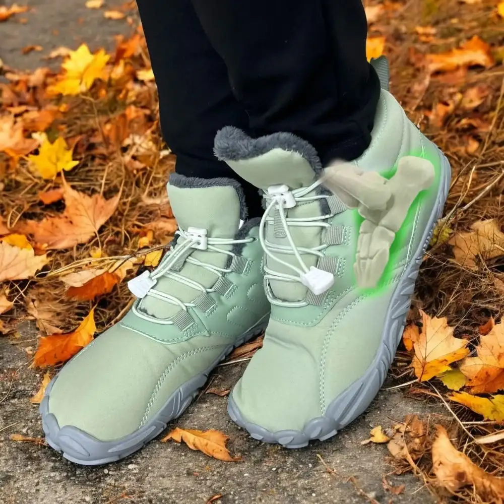 Gray sneakers on a leaf-covered path in autumn.
