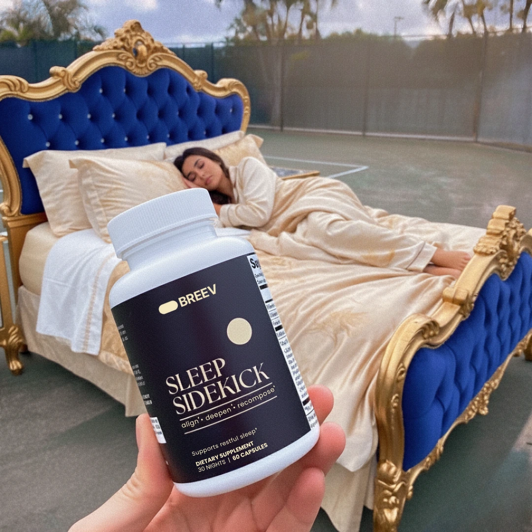 Person sleeping in bed outdoors with a supplement bottle in the foreground.