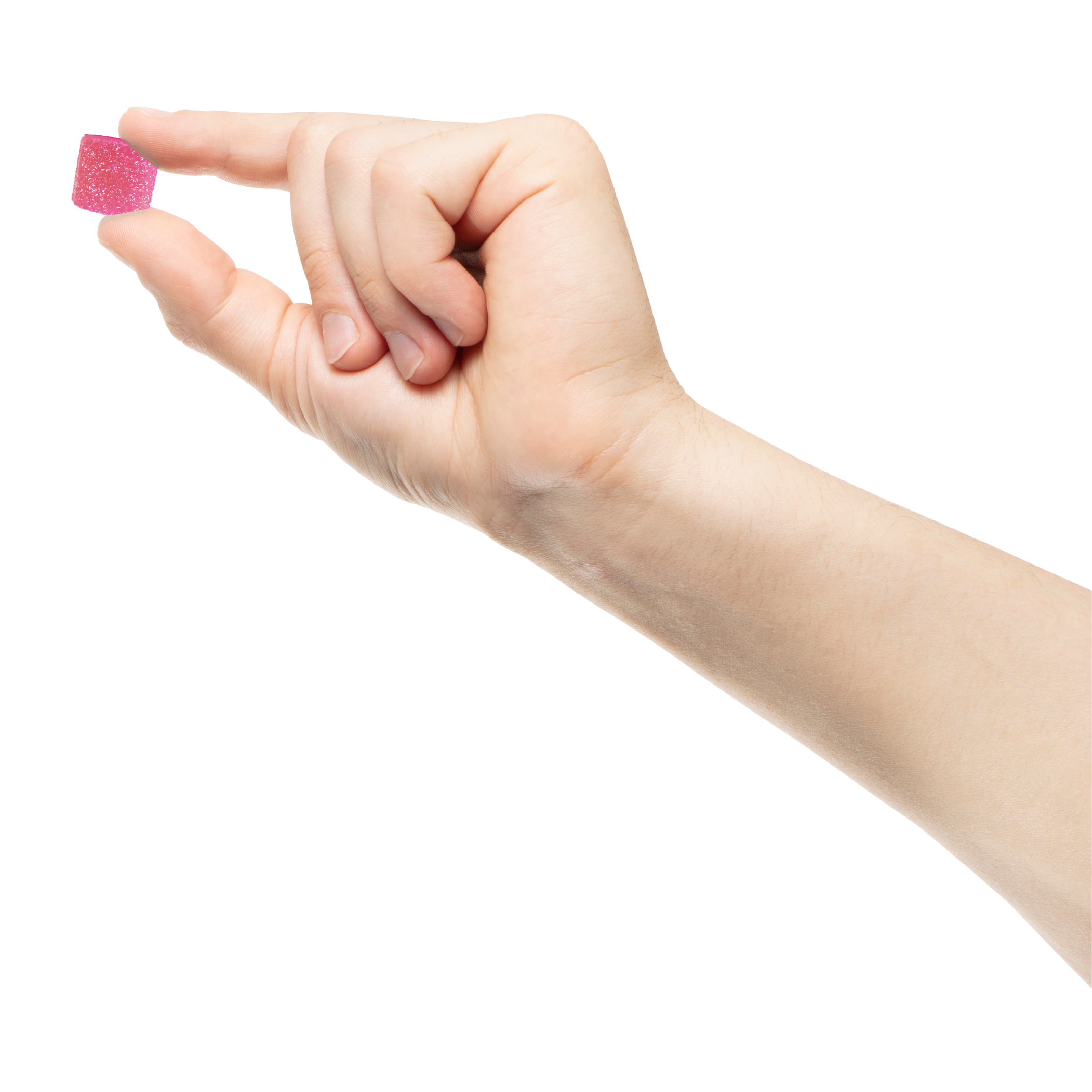 Hand holding a small pink candy between fingers.