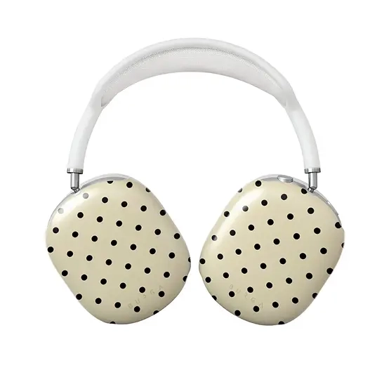 White headphones with cream-colored earcups featuring a black polka dot pattern against a white background.