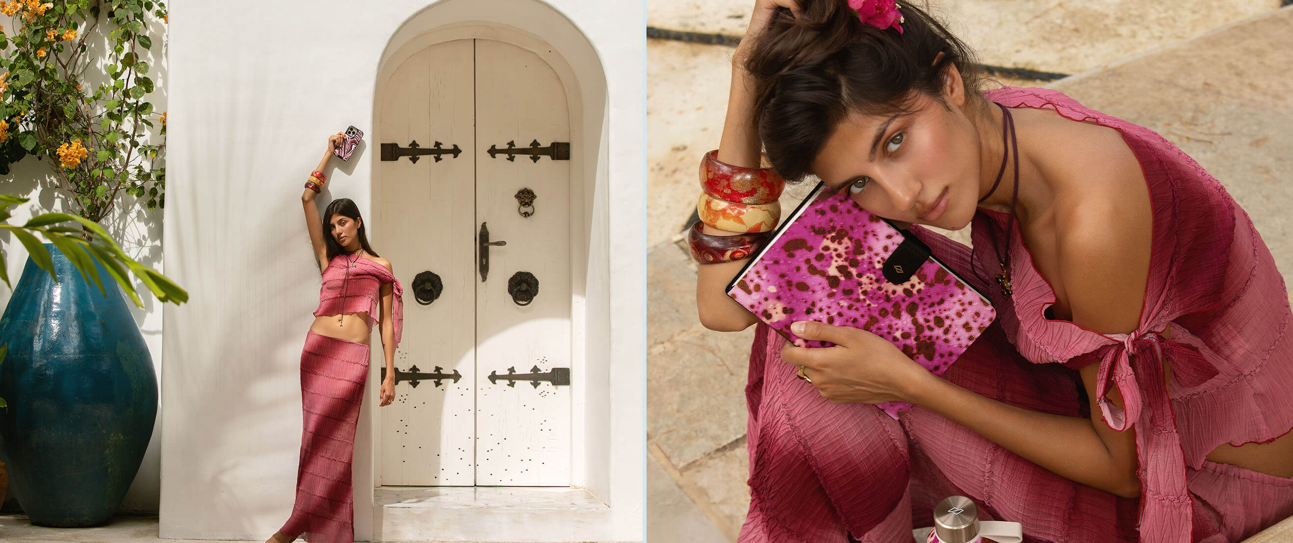 Woman in pink outfit posing with accessories by a white door and large blue vase.