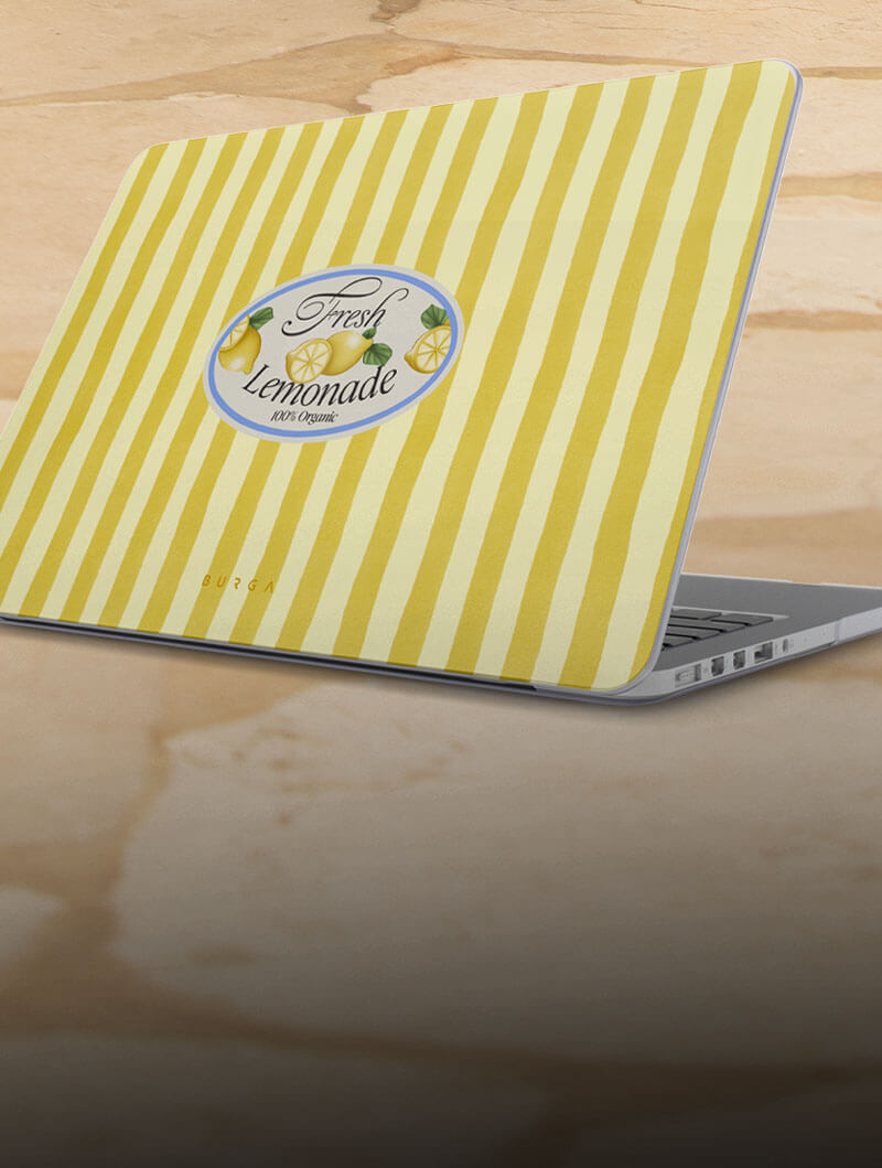 Laptop with yellow striped cover featuring 'Fresh Lemonade' design.