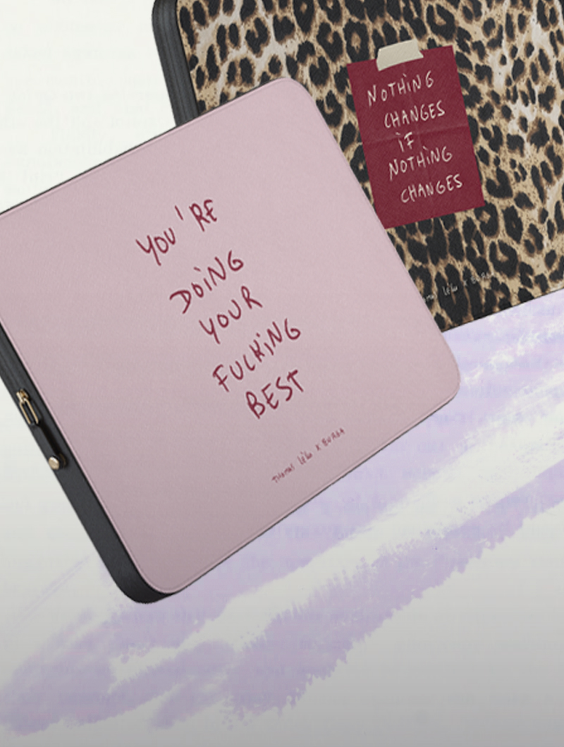 Two textured notebooks with motivational quotes and black border.