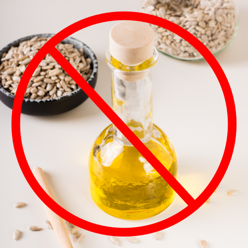 Oil bottle with red prohibition circle and sunflower seeds.