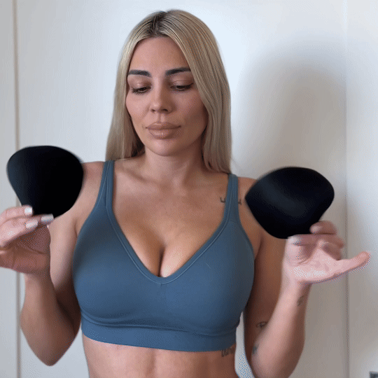 People exercising on a mat in athletic wear.