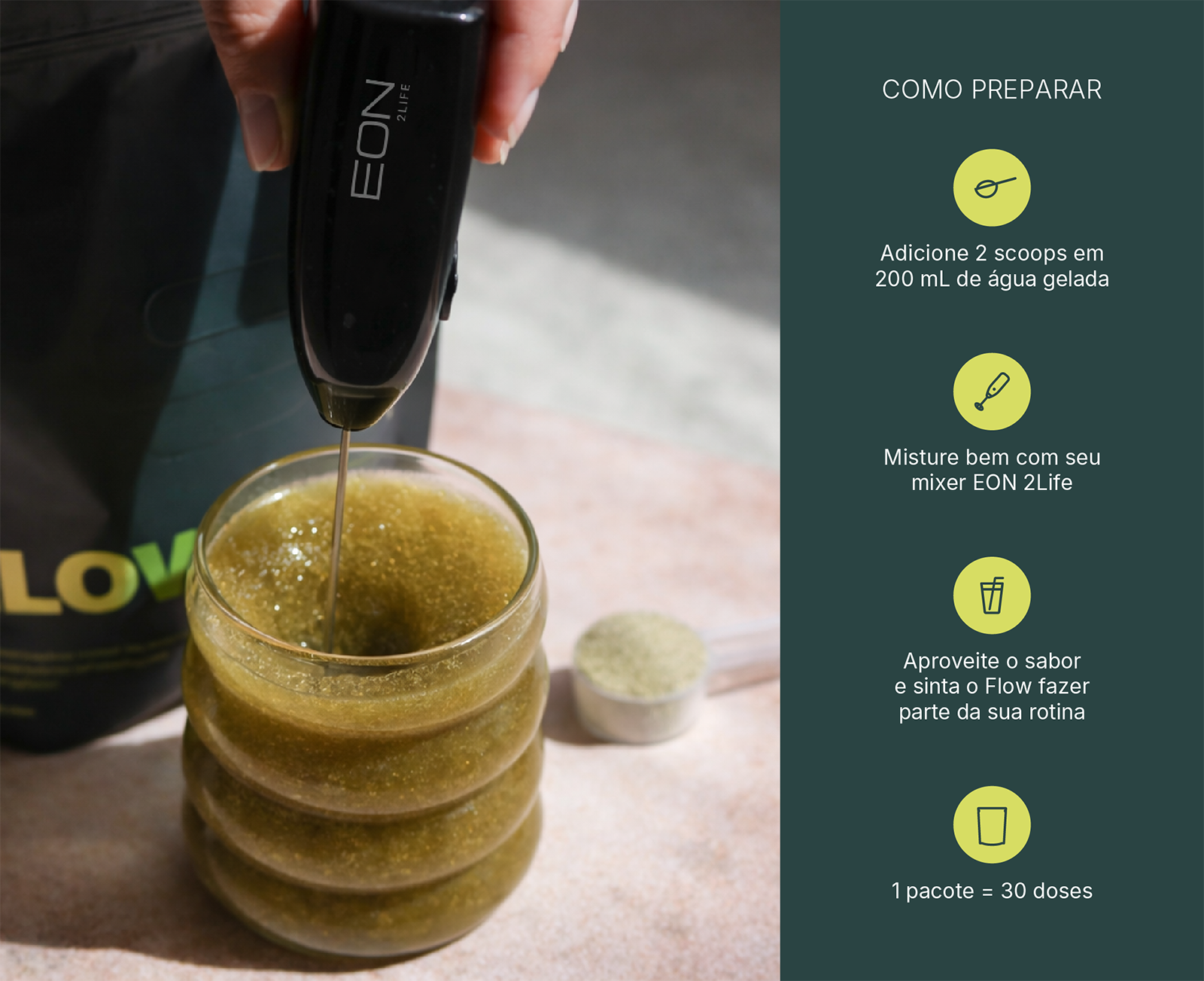 A hand mixes a green drink in a ribbed glass with a frother next to preparation instructions.