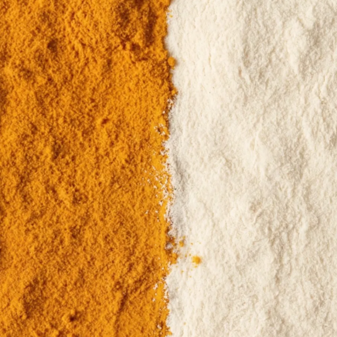 A close-up, top-down view of orange powder and white powder laid side-by-side on a surface.