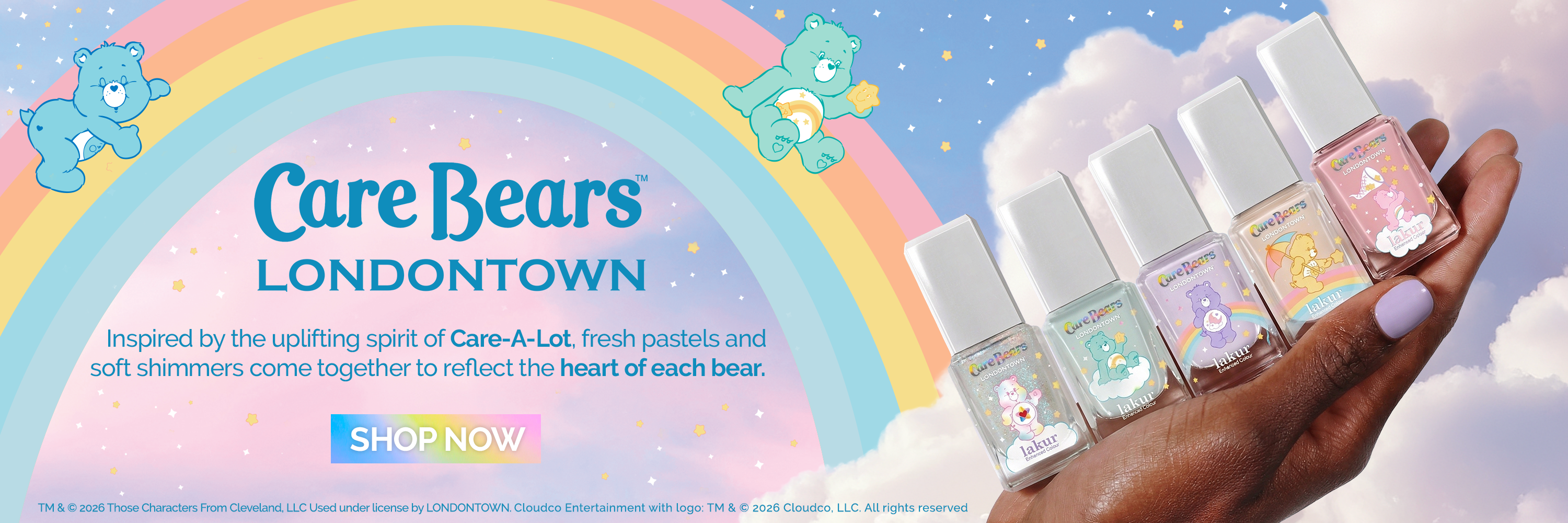 A hand holds bottles of Care Bears themed nail polish against a pastel rainbow and cloud background.