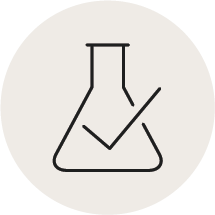 A line drawing icon of a laboratory flask with a checkmark inside a light-colored circle.