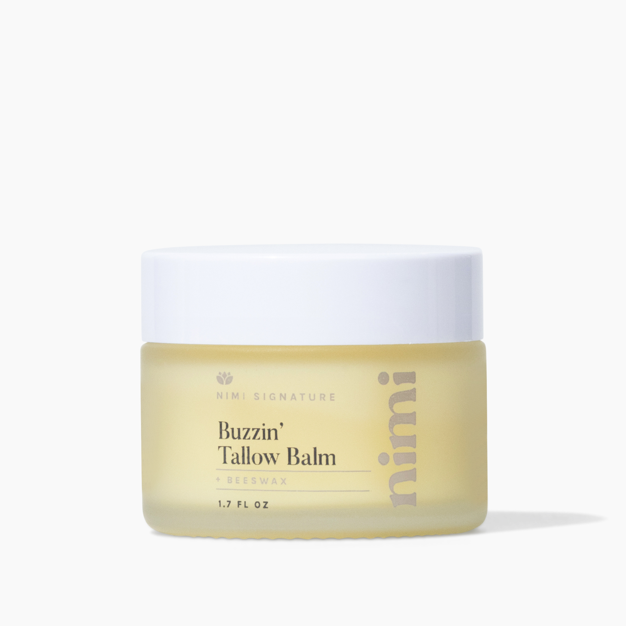 A frosted glass jar of Nimi Signature Buzzin' Tallow Balm with a white lid on a white background.
