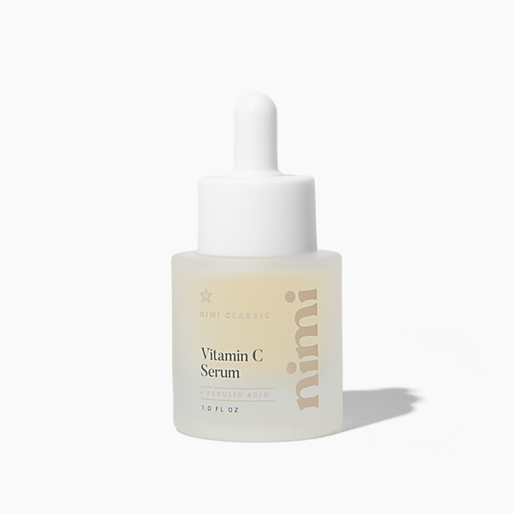 A frosted glass dropper bottle of Nimi Classic Vitamin C Serum against a white background.