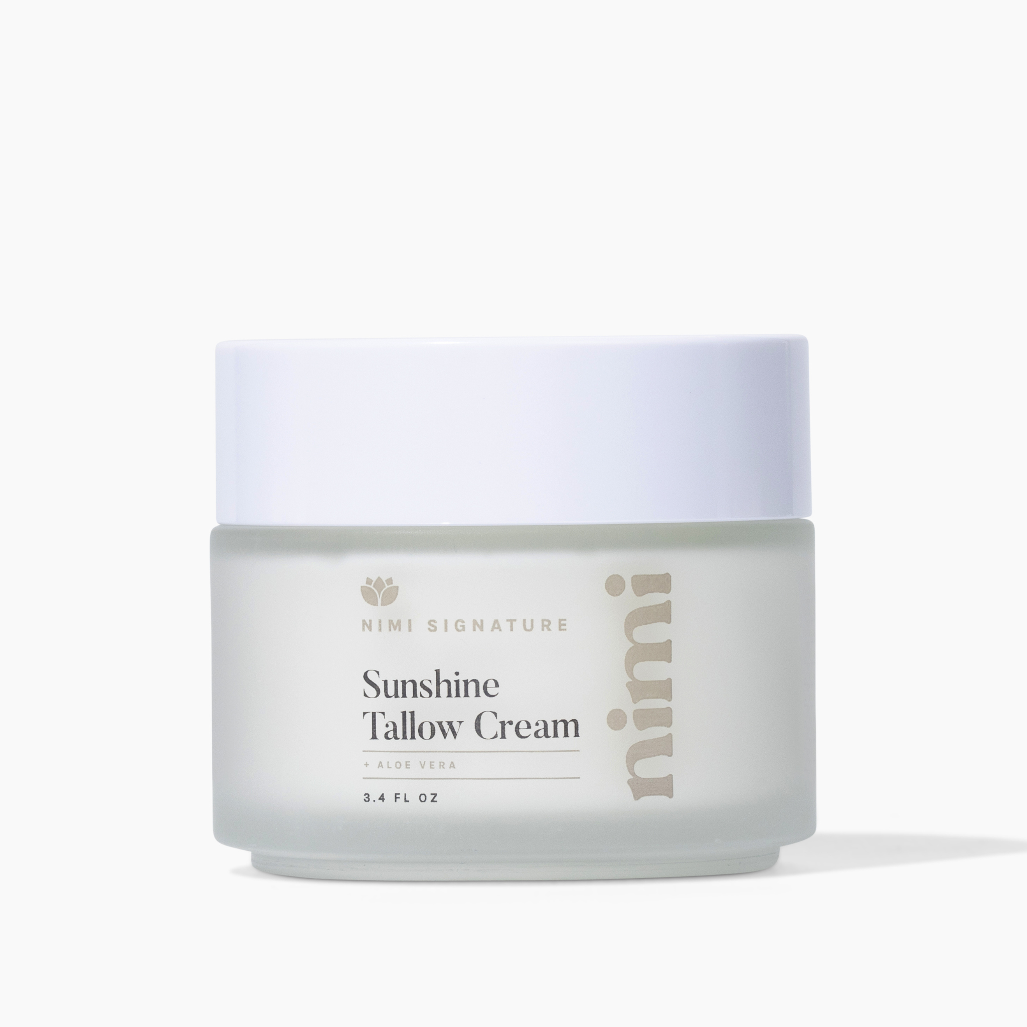 A frosted glass jar of Nimi Sunshine Yellow Cream with a white lid on a white background.