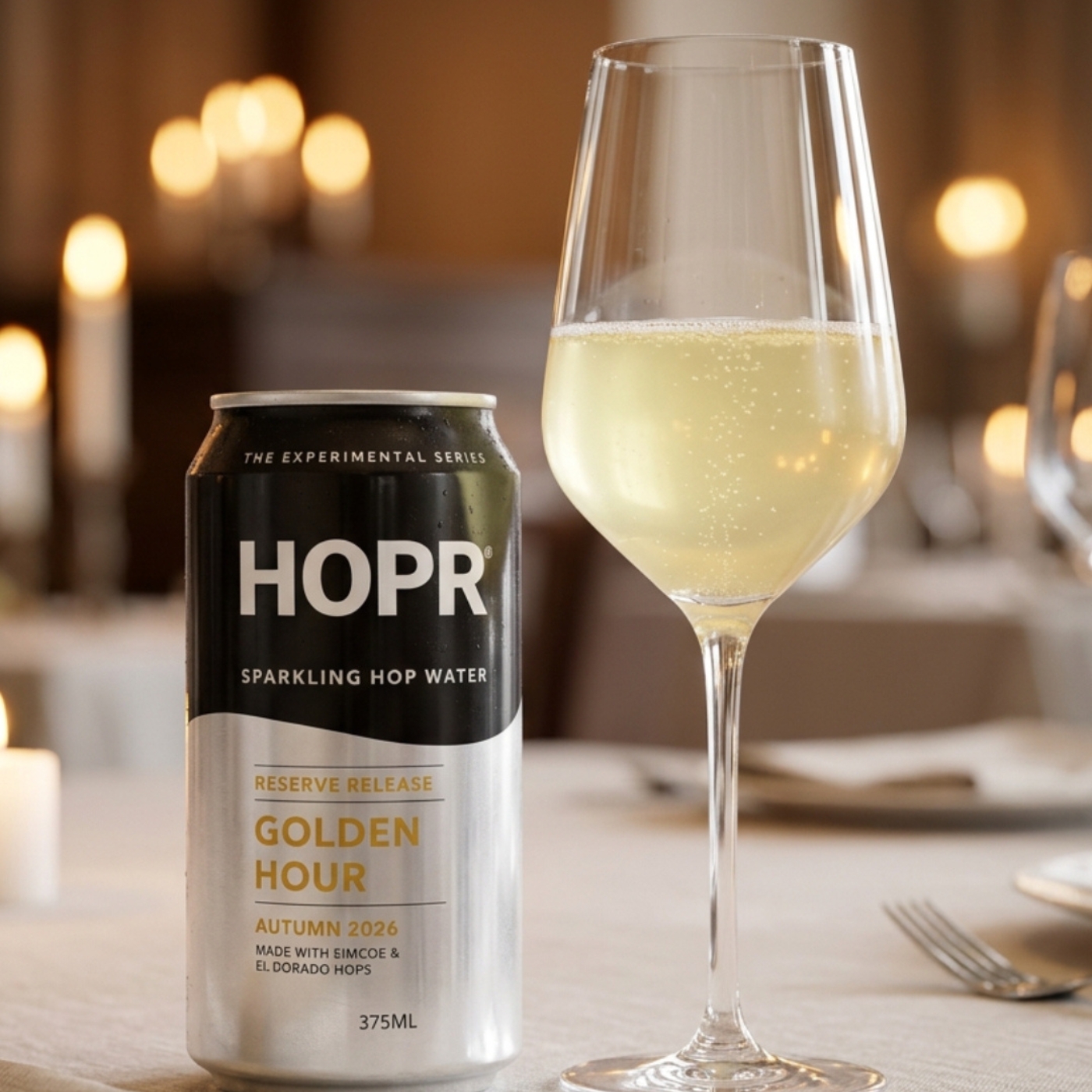 A can of HOPR Sparkling Hop Water next to a wine glass of the same beverage on a dinner table.