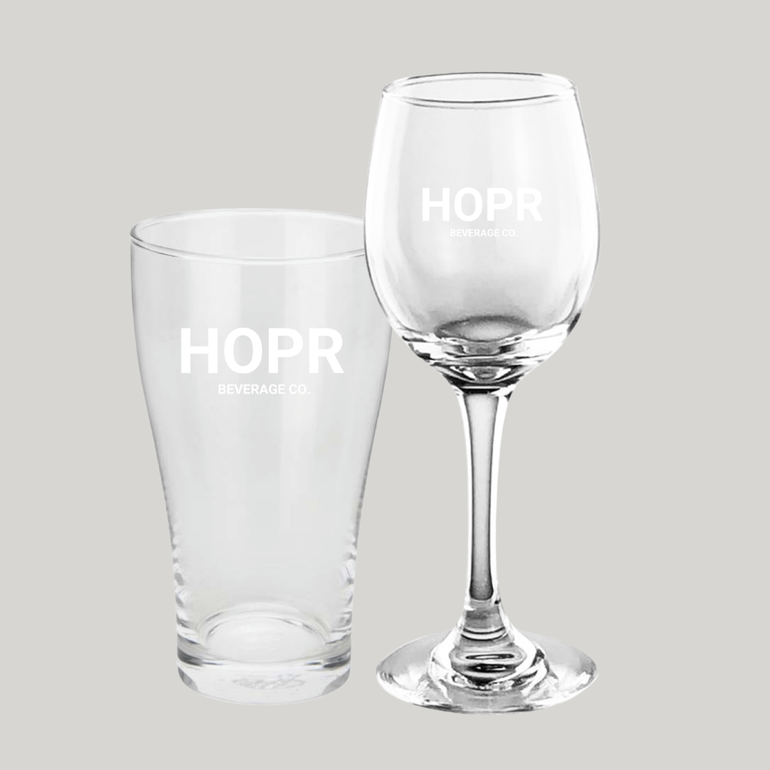 A pint glass and a stemmed wine glass, both with the 'HOPR BEVERAGE CO.' logo.