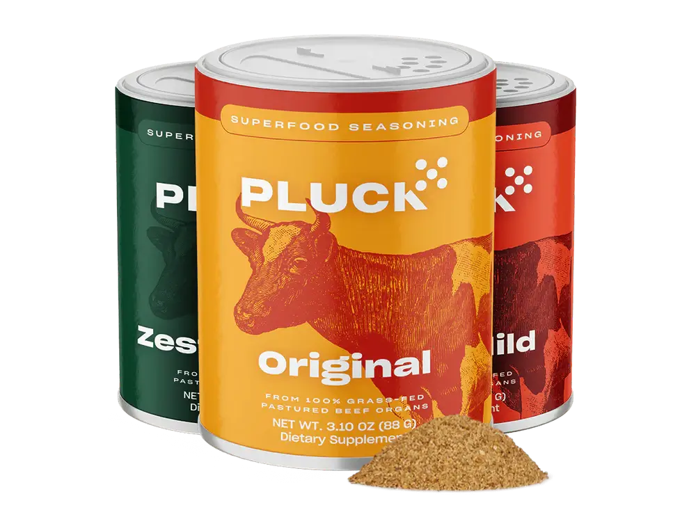 Three containers of Pluck superfood seasoning with different flavors.