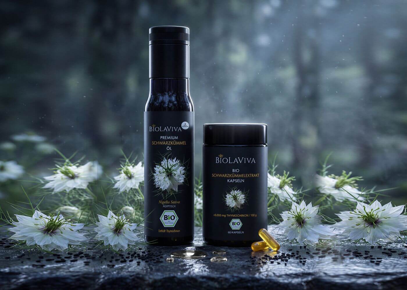 Biolaviva black cumin oil and capsules surrounded by white flowers and seeds on a wet surface.