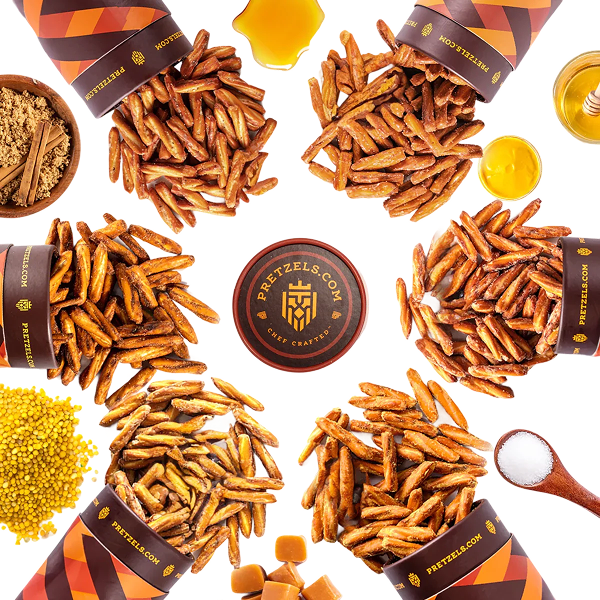 Various seasoned pretzel sticks and ingredients arranged in a circular pattern.