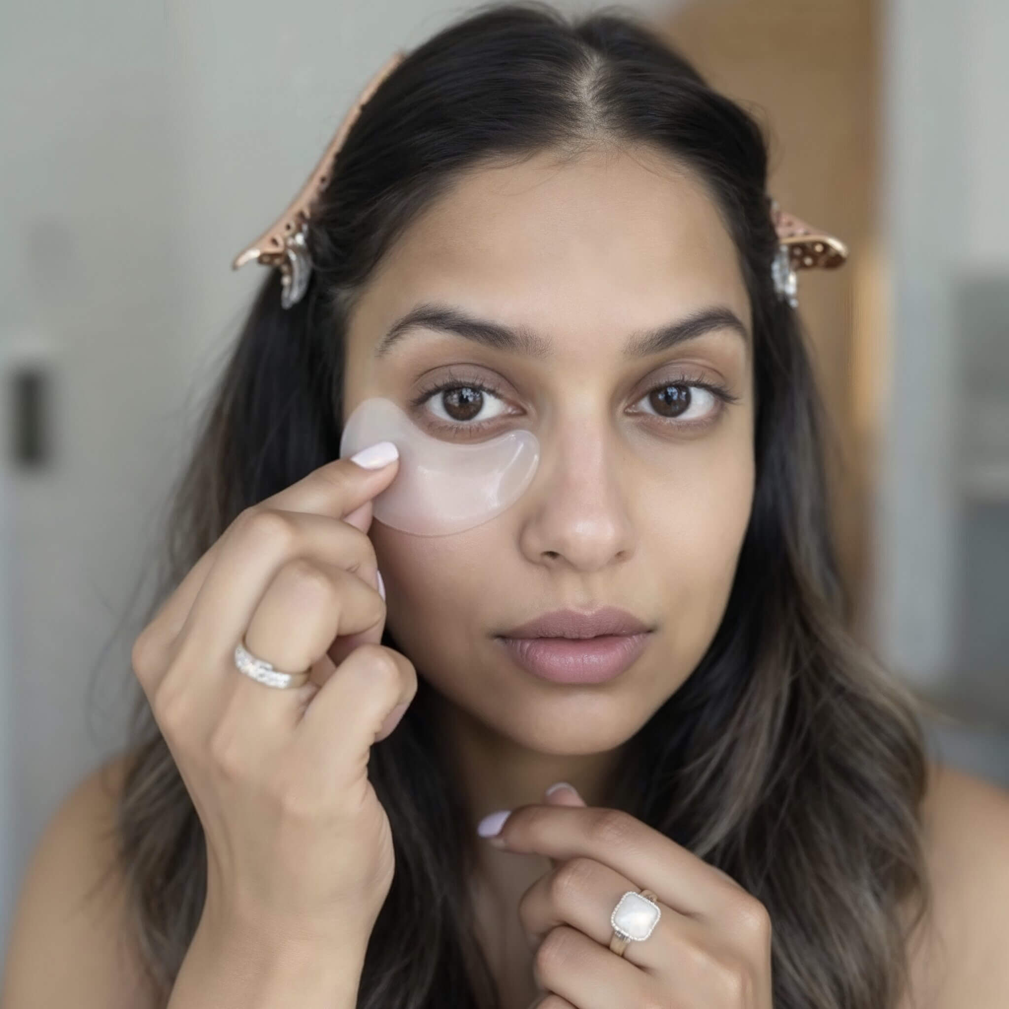 Creator putting on under eye patch.