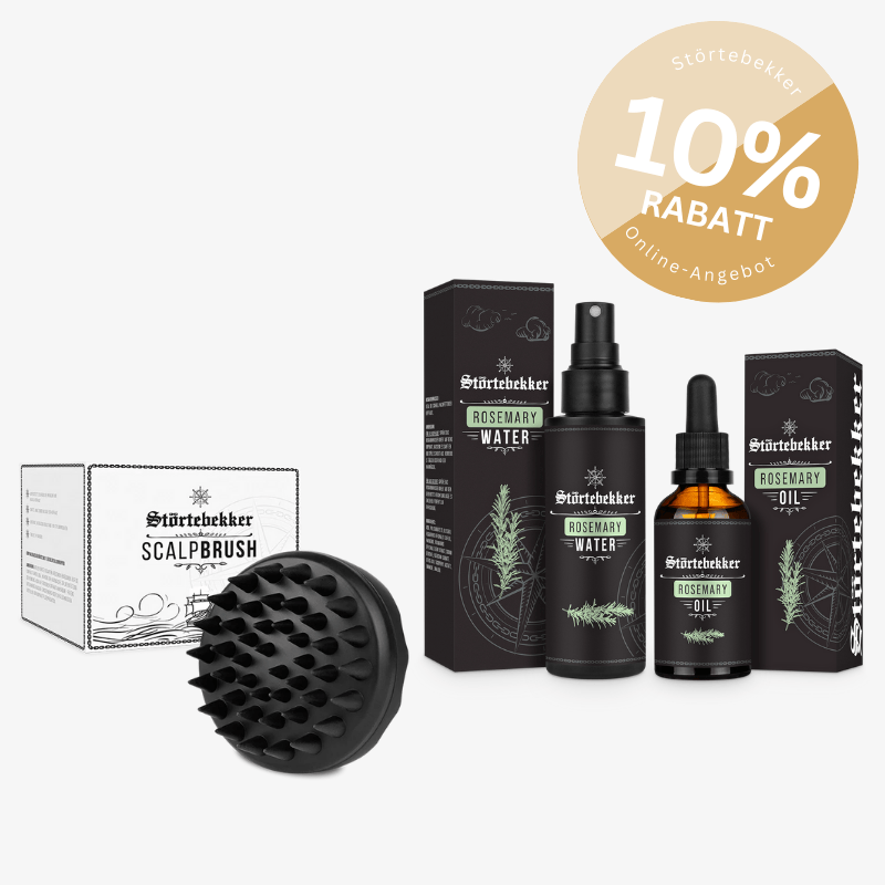 Hair care products with a scalp brush and rosemary water and oil bottles.