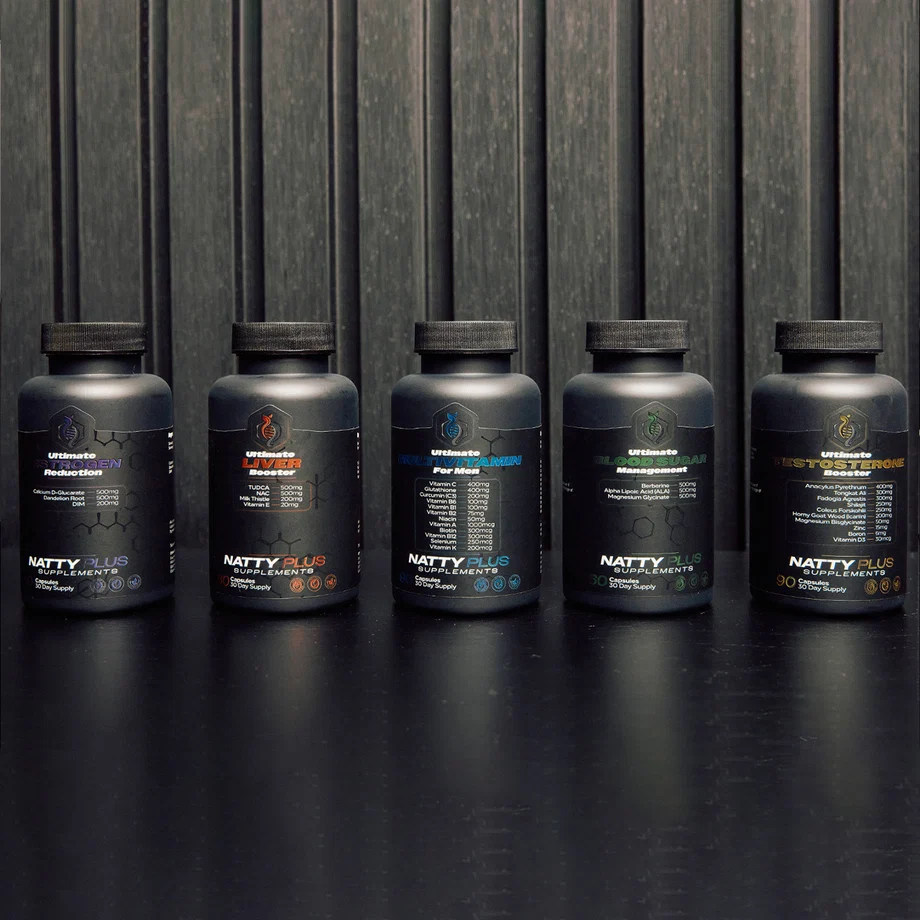 Five black bottles of Natty Plus supplements lined up on a dark surface against a textured background.