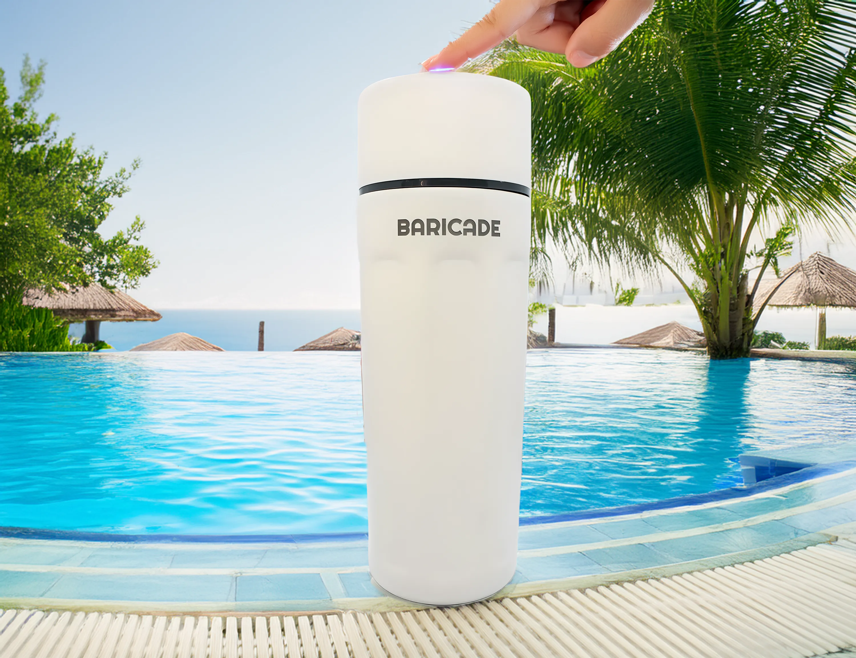 White cylindrical device labeled 'BARICADE' by a pool with palm trees.