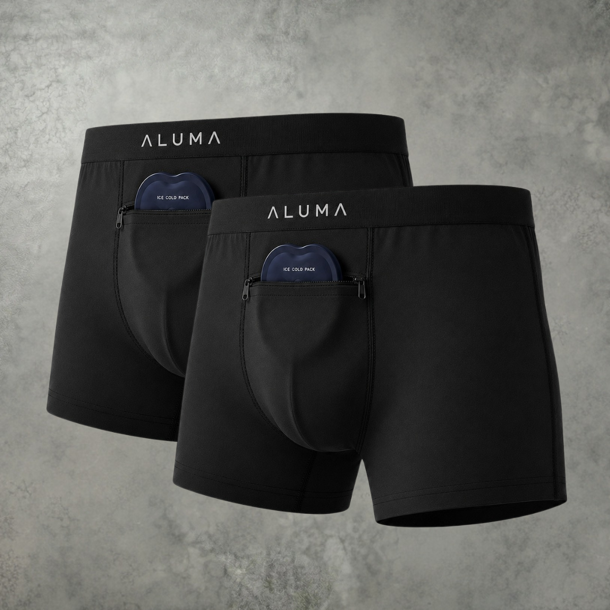 Two pairs of black Aluma boxer briefs with zippered front pockets holding ice cold packs.