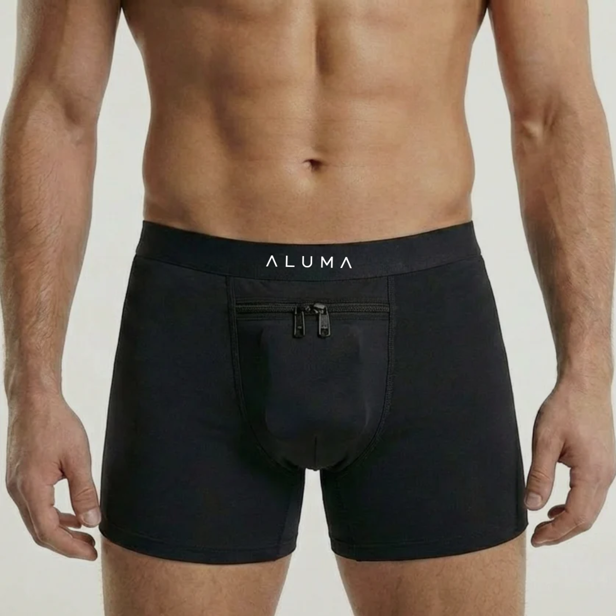 A man's torso wearing black Aluma brand boxer briefs with a zippered pouch on the front.
