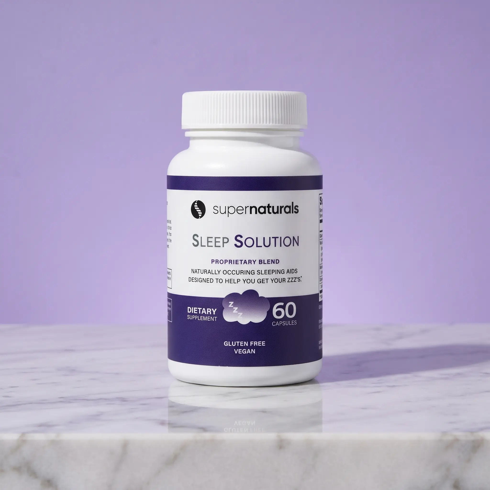 A white bottle of supernaturals Sleep Solution supplements sitting on a marble surface against a purple background.