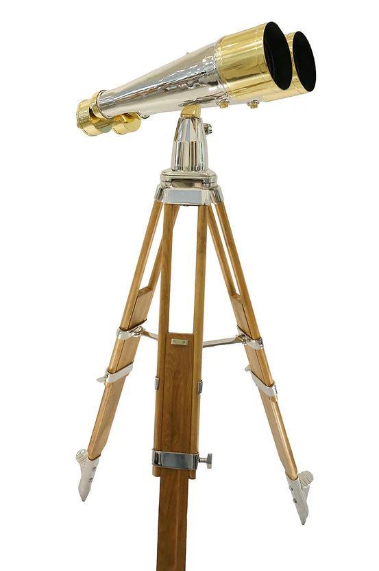 A brass and silver telescope on a wooden tripod.