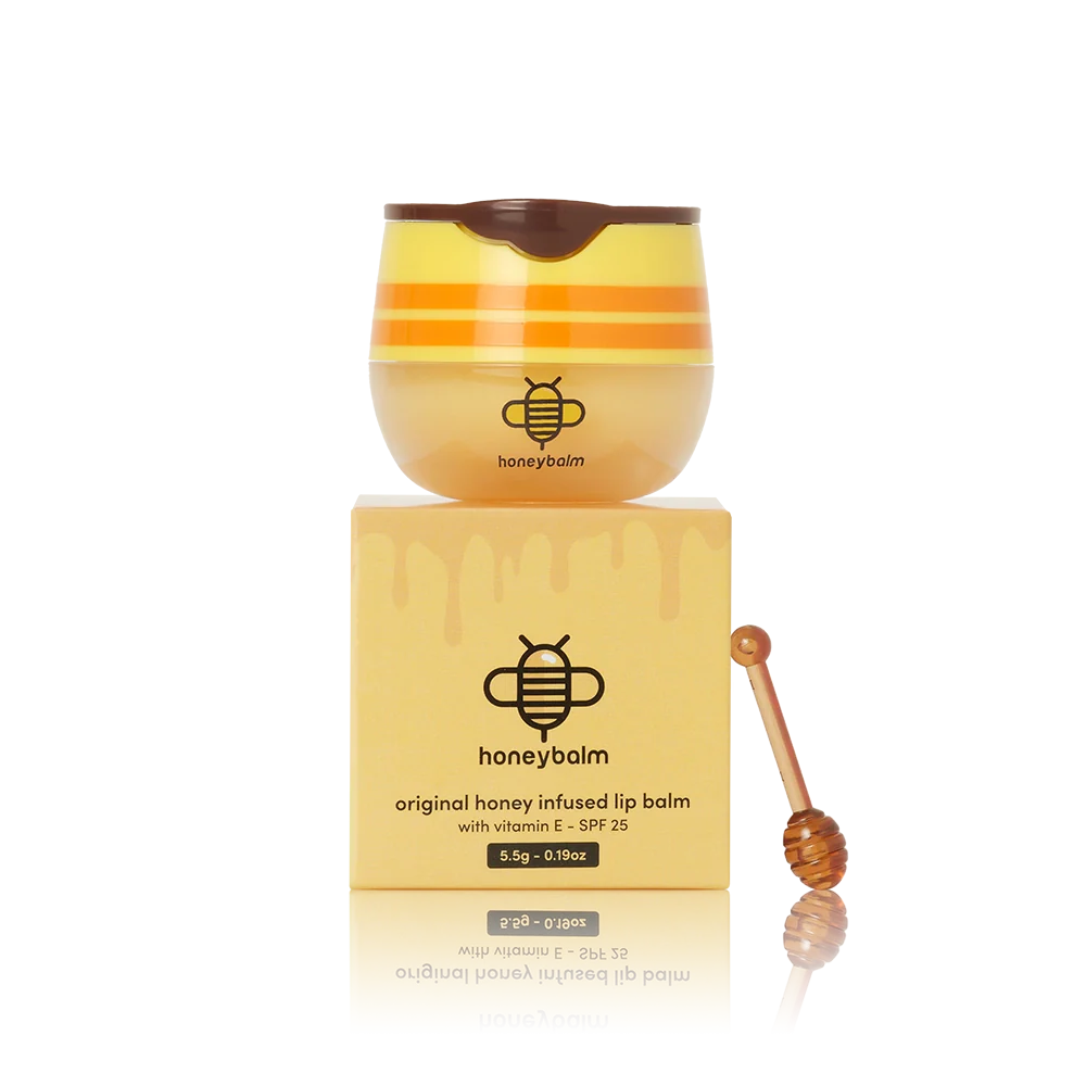 Honey-themed lip balm container on a matching box with a honey dipper.