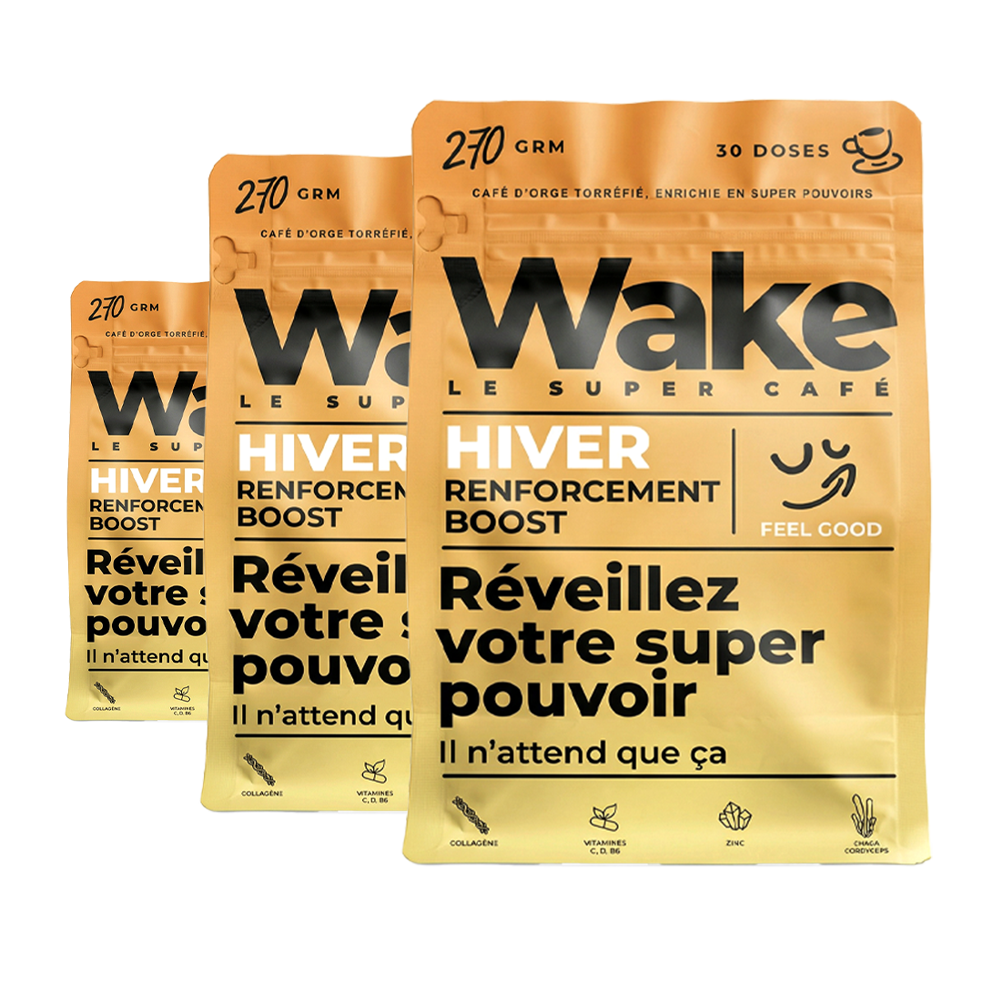 Three gold pouches of Wake Le Super Café's Hiver Renforcement Boost, staggered in a row.