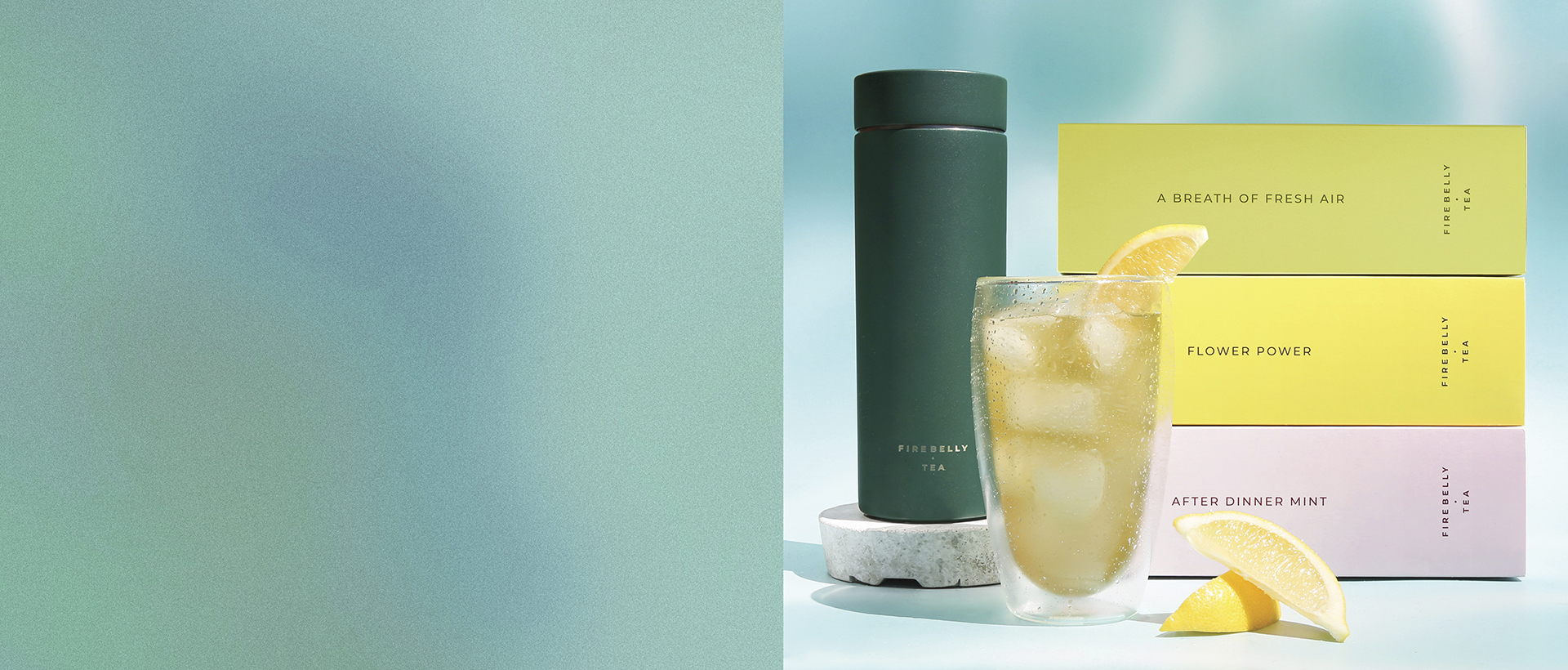 Green bottle and iced tea glass with lemon slices and colorful tea boxes.