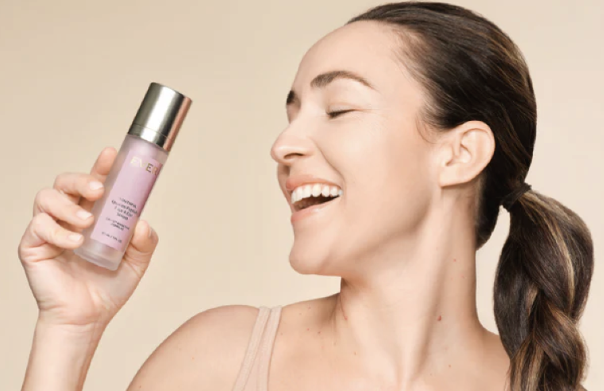 Model holding EVER Youthful Quattro Peptide Serum