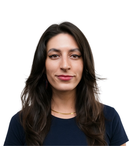 A person with long dark hair wearing a navy top against a white background.