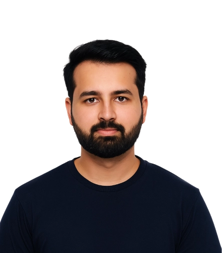 Man with beard wearing a black shirt on a white background.