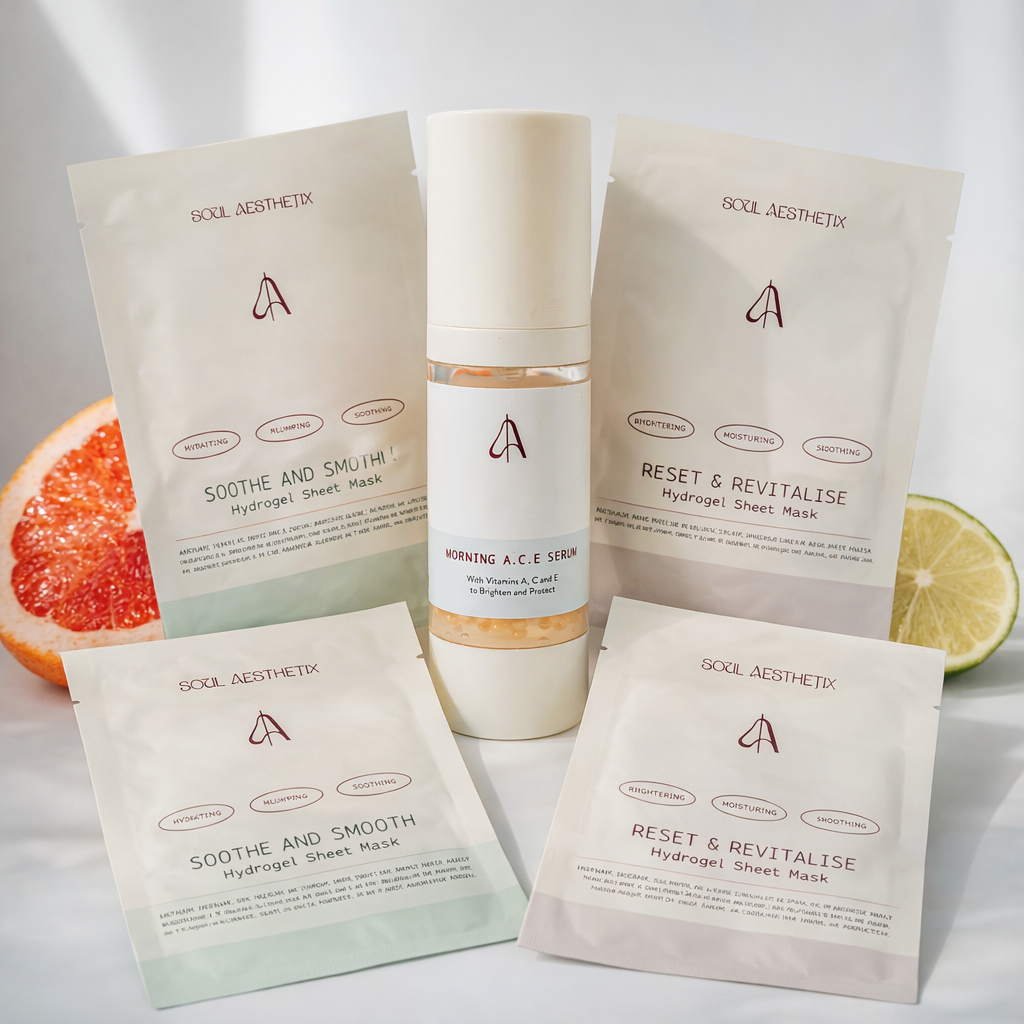 Soul Aesthetix serum and hydrogel sheet masks displayed with slices of grapefruit and lime.