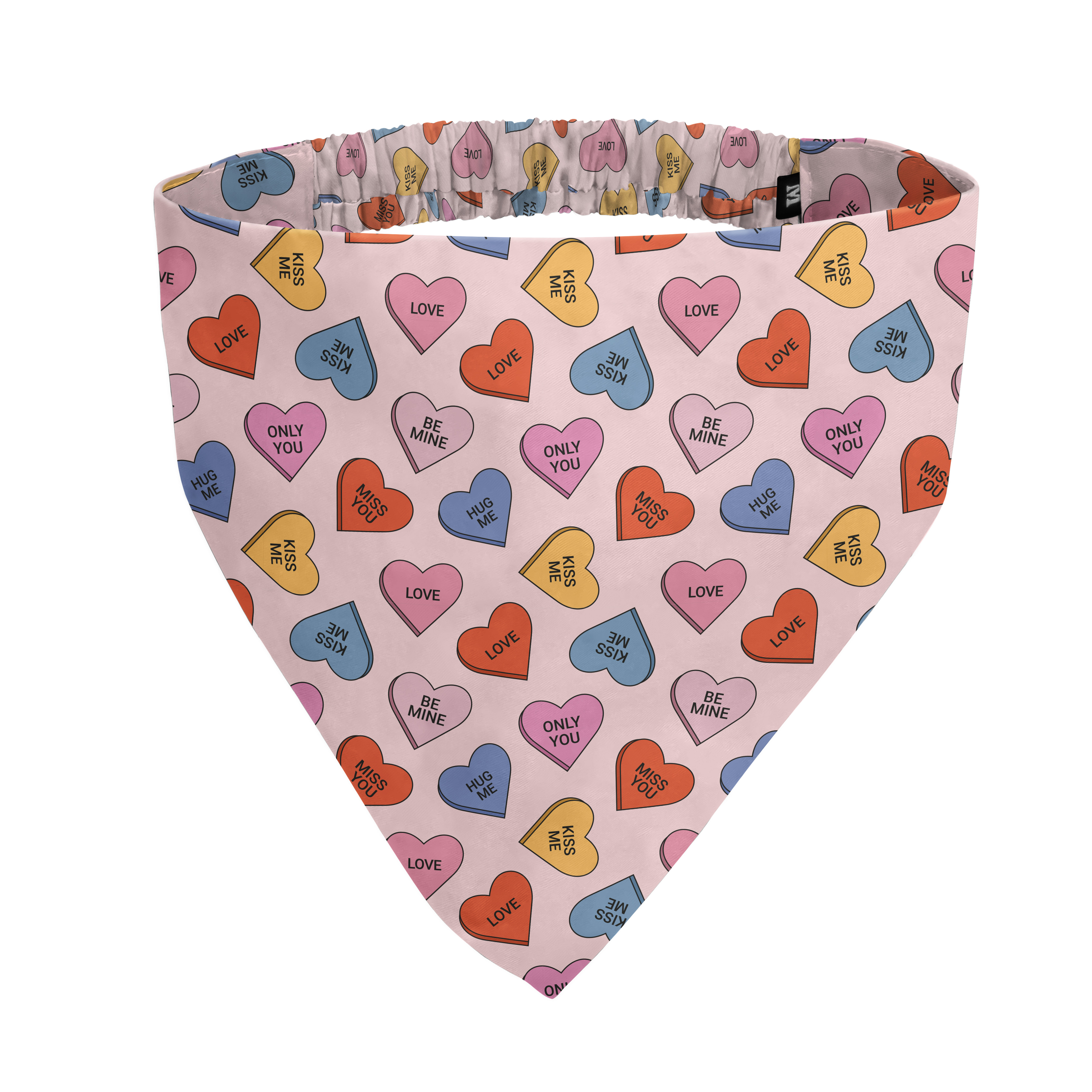 A pink pet bandana with a pattern of colorful candy conversation hearts on a white background.