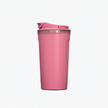 Pink reusable tumbler with lid on white background.
