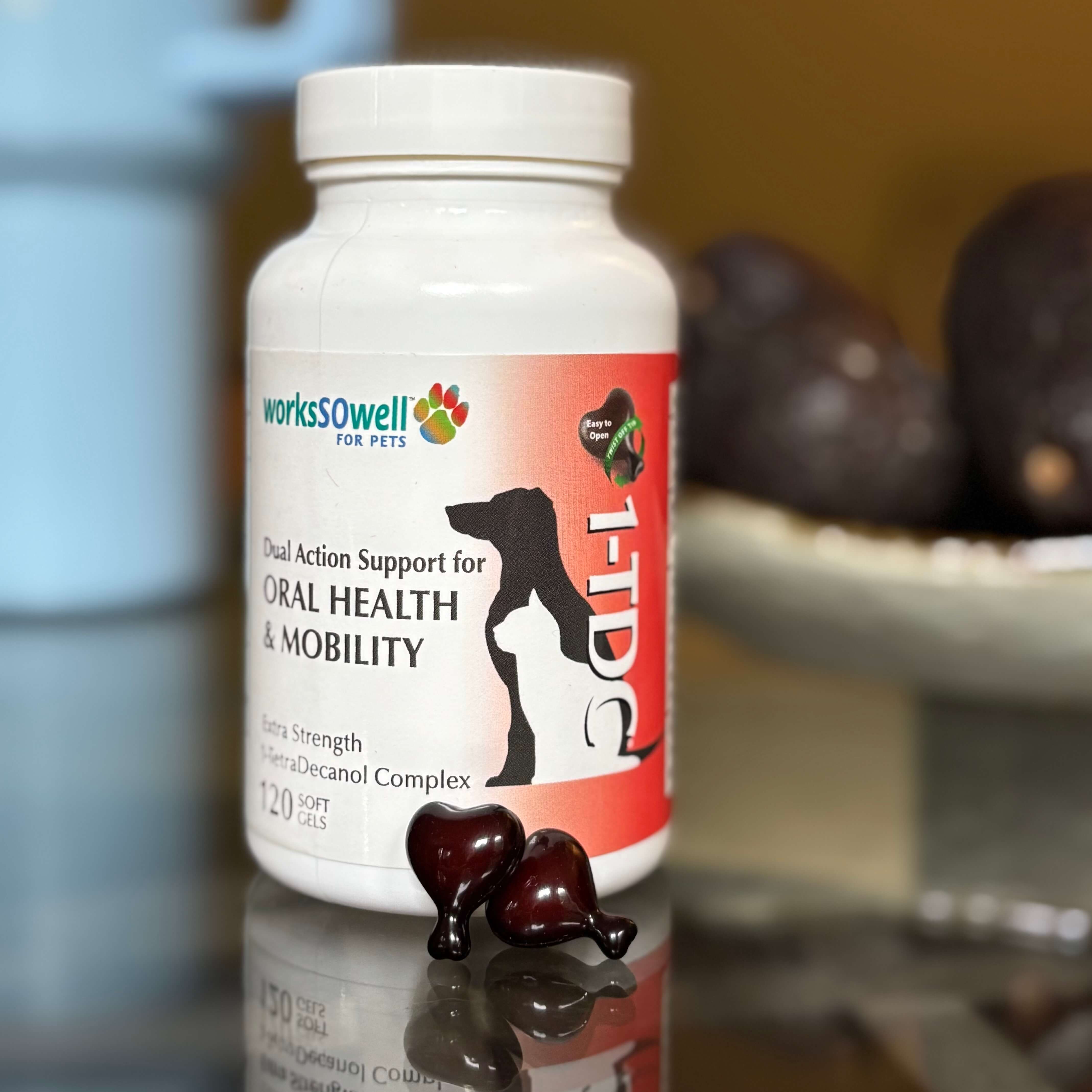 Pet supplement bottle with two heart-shaped capsules in front.