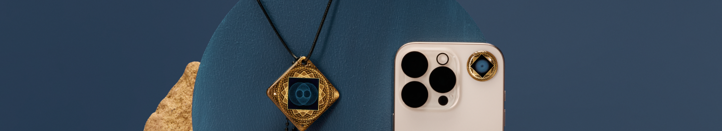 Smartphone and ornate pendant with blue and gold design on a blue background.