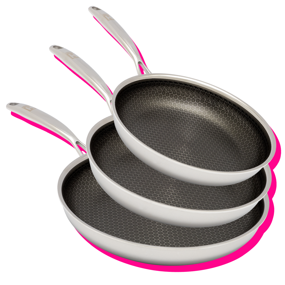 Three stacked frying pans with hexagonal non-stick surfaces on a pink background.