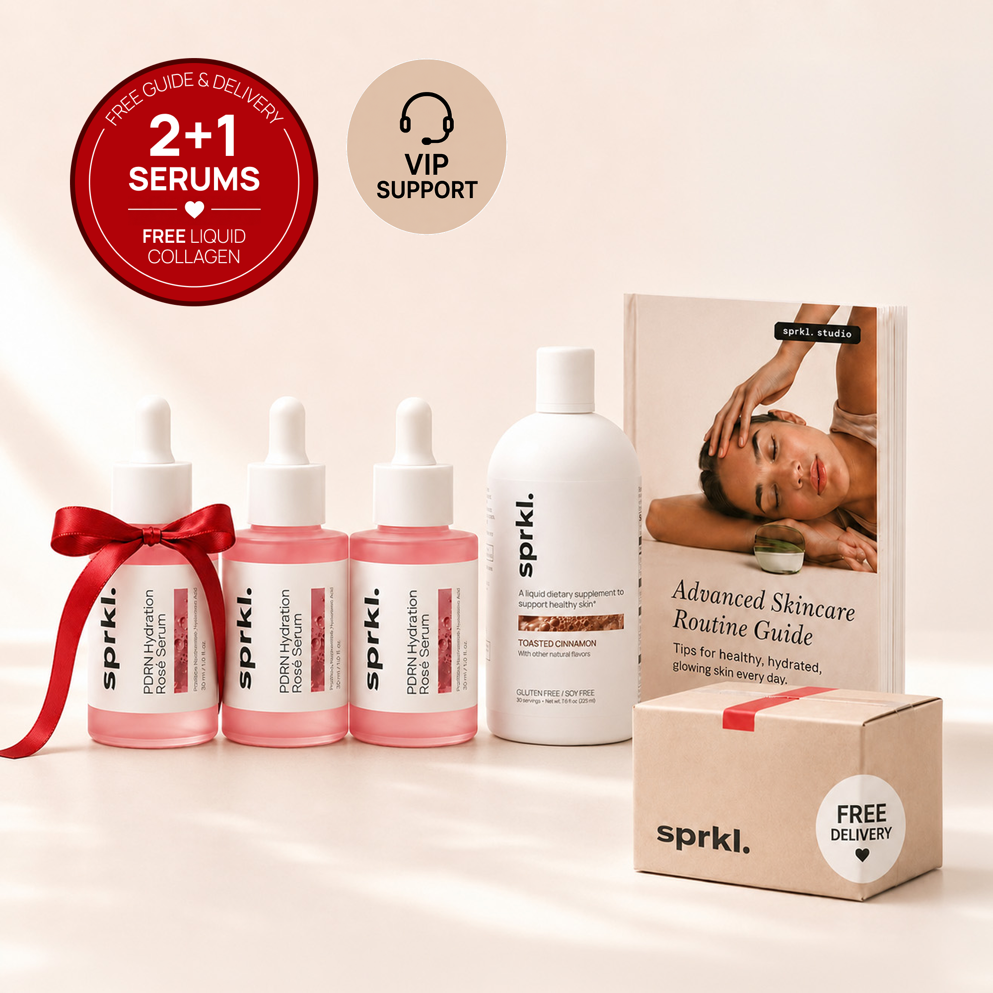 A promotional arrangement of sprkl. brand skincare products, including serums, a supplement, a guide, and a shipping box.
