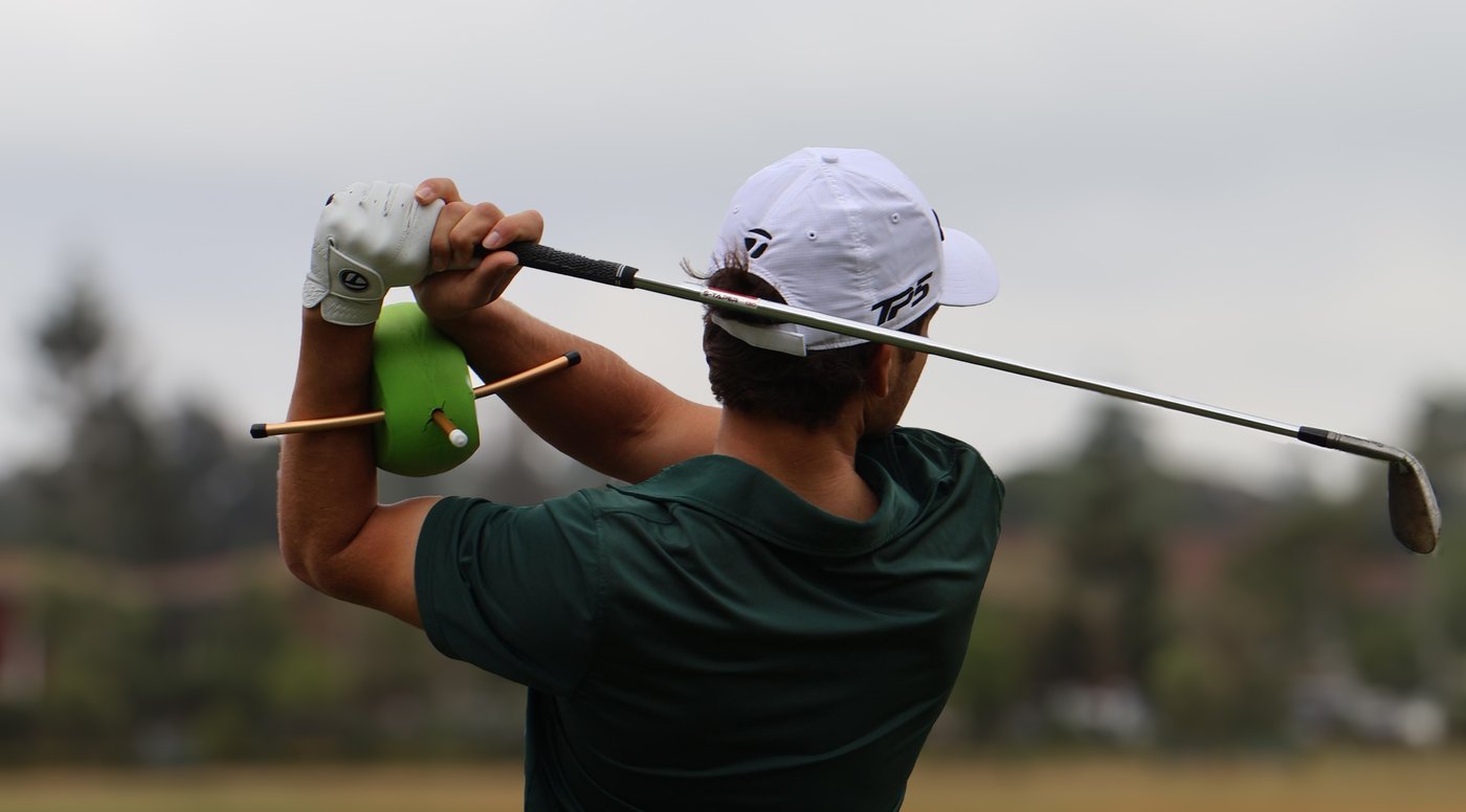 Golfer training with The Connector