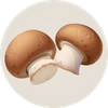 A circular icon showing two brown cremini mushrooms with white stems.
